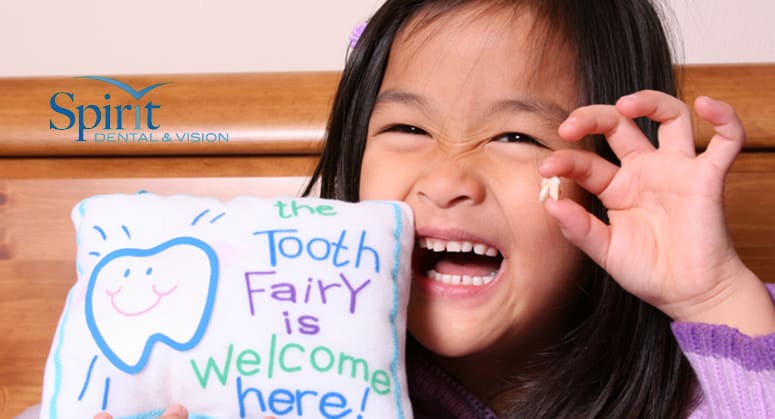 kids smiling in a classroom before eating lunch