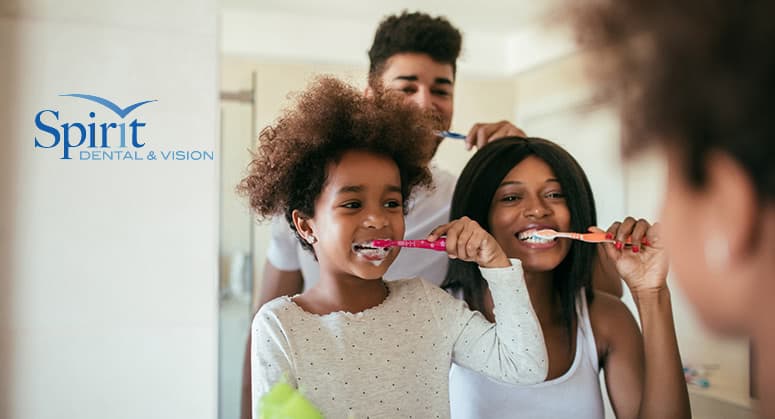 Photo of family brushing their teeth together