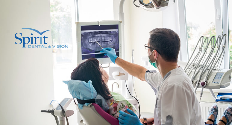 Doctor Dentist Showing Patients Teeth On Xray