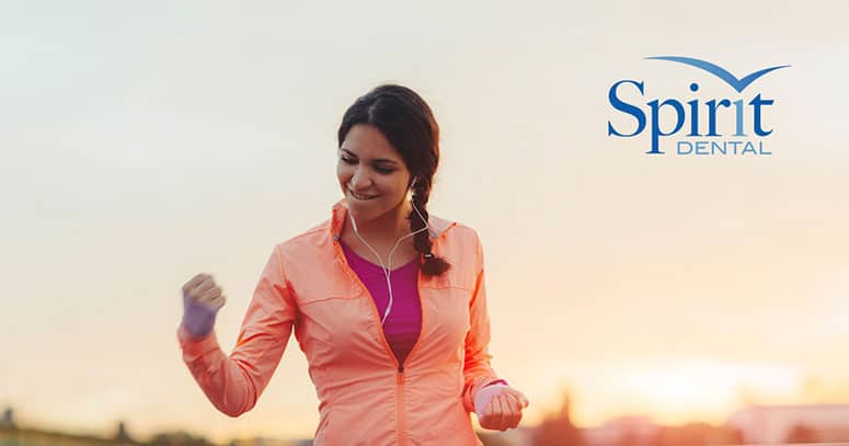 Lady pumping her fist in celebration of her exercise goal being met