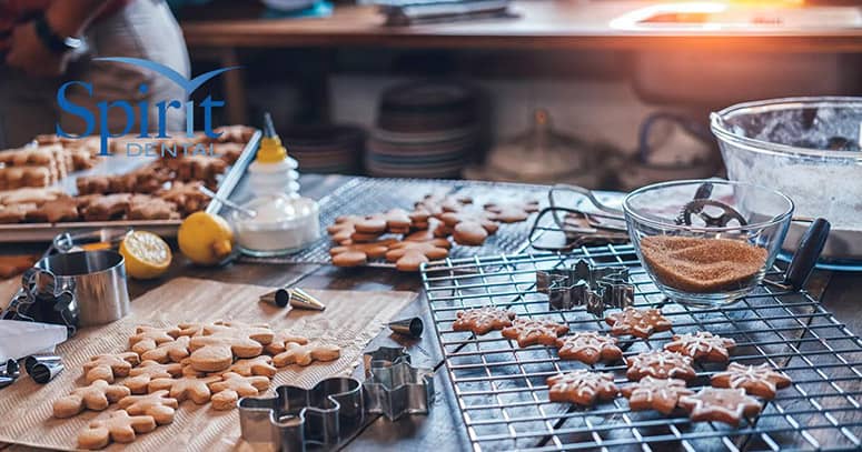 A table full of gingerbread men and cookies during the holidays