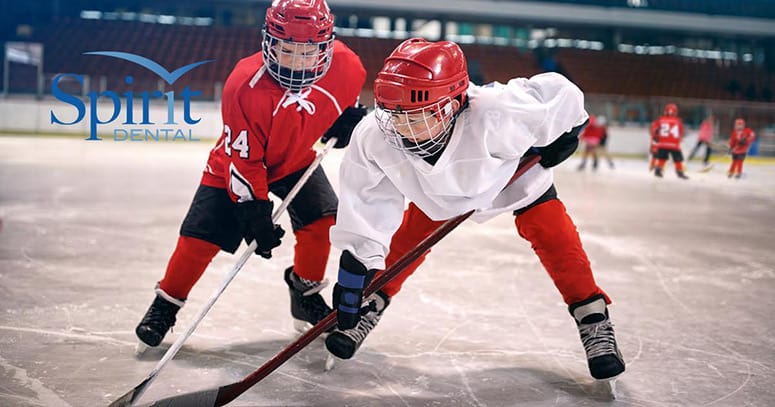 Two boys playing hockey