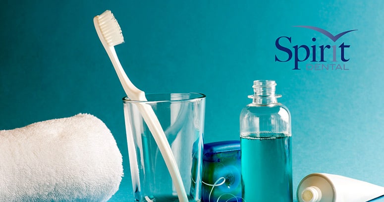 Sink counter with toothbrush, towel, toothpaste, and mouthwash