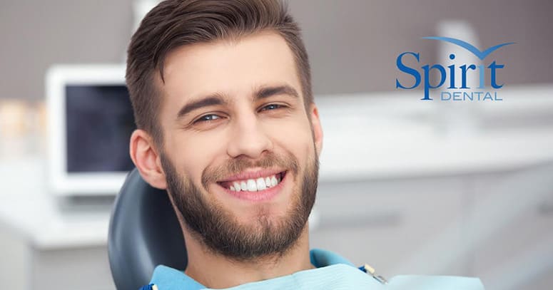 Man in dentist chair smiling